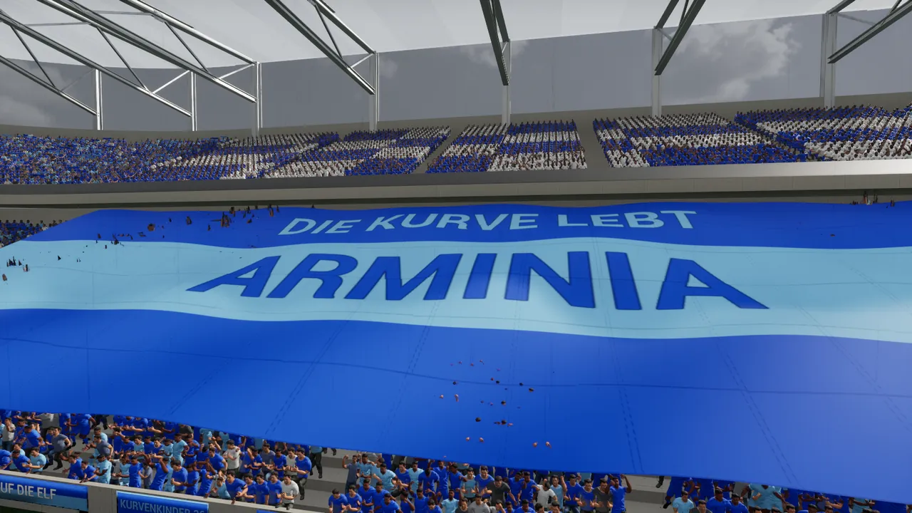 Unparteiisch in-game capture: “Die Kurve lebt” – the home end celebrates its club.